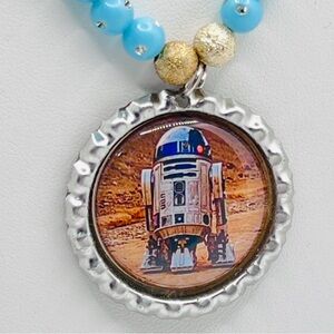 Star Wars R2-D2 pendant necklace with a bottle cap design.